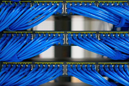 lan cable wiring and networking in the network or server rack in the data center.